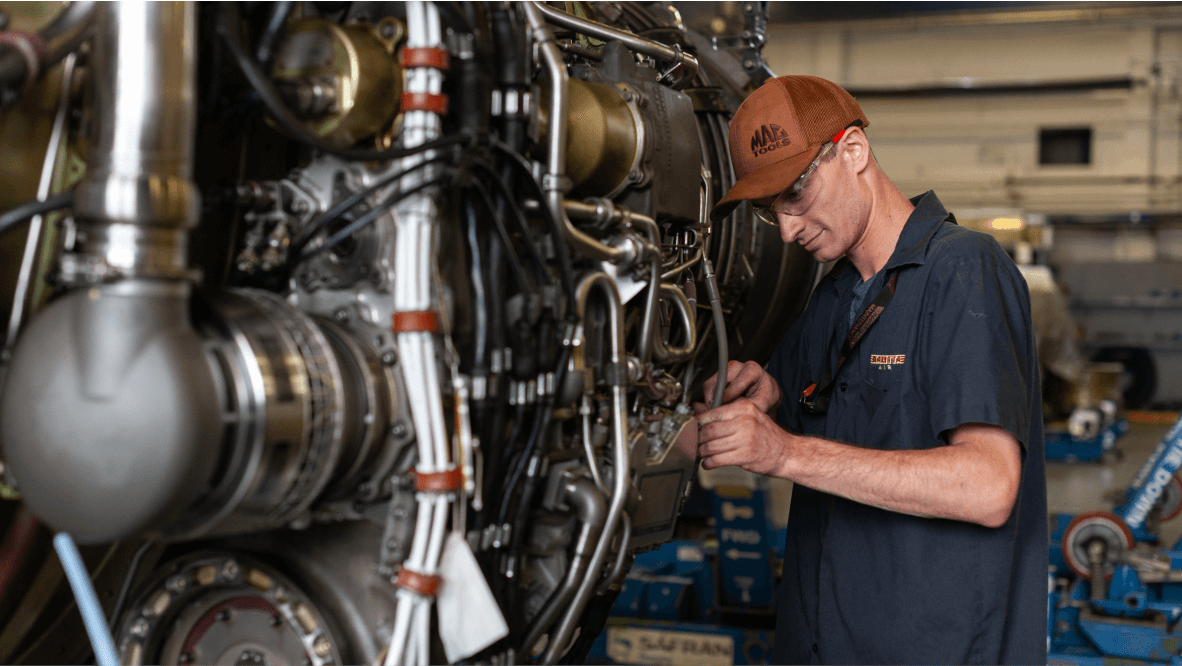 Kalitta Air Power Plant Services employee working on engine