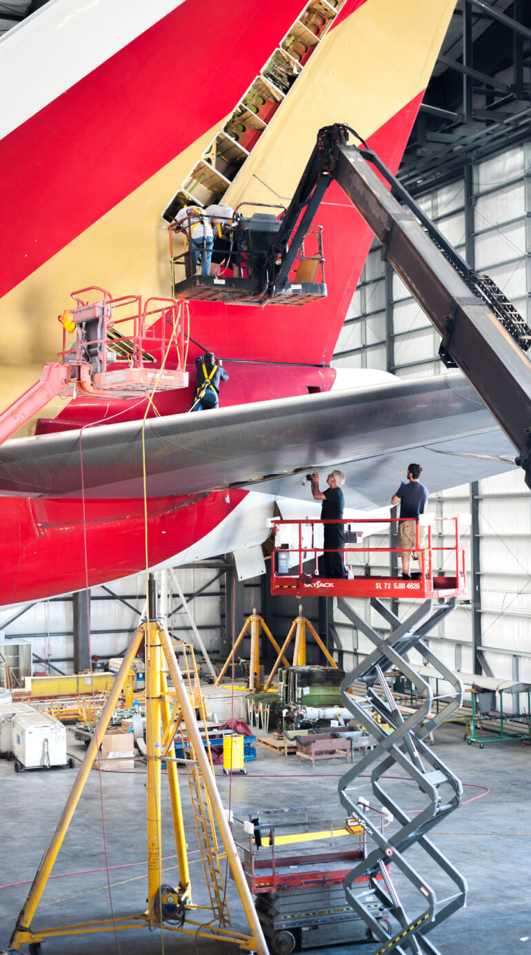 Kalitta Air Air Frame Services employees working on a plane