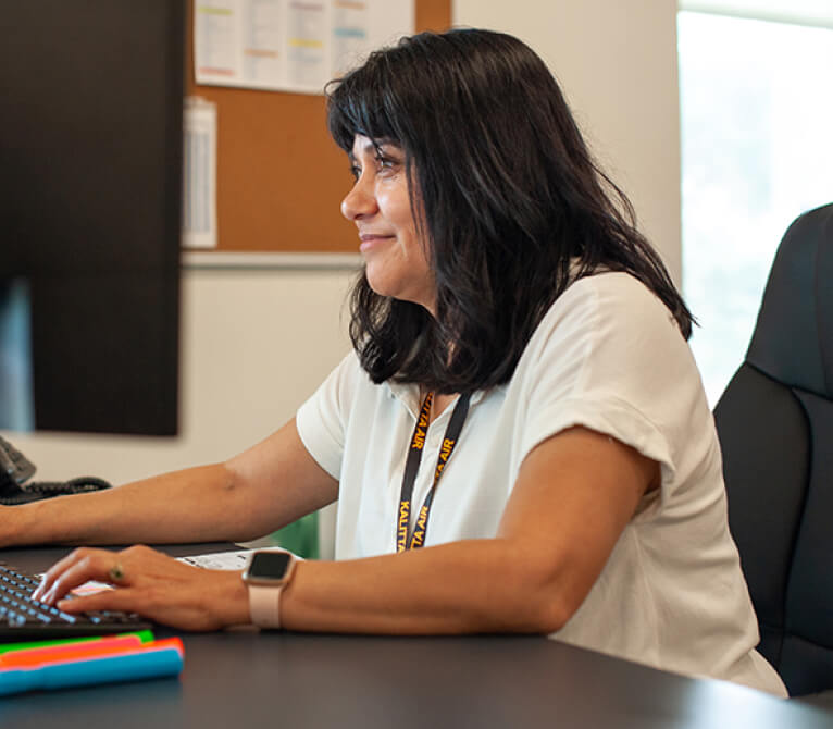Kalitta Air employee at computer