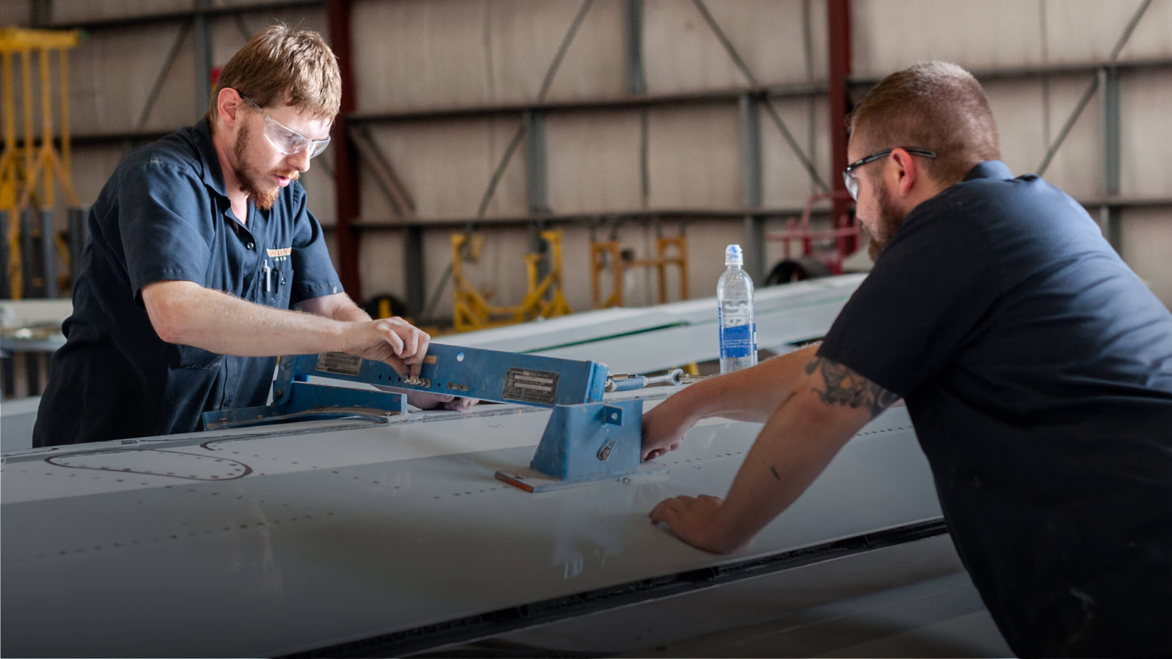 Kalitta Air employees working on a wing