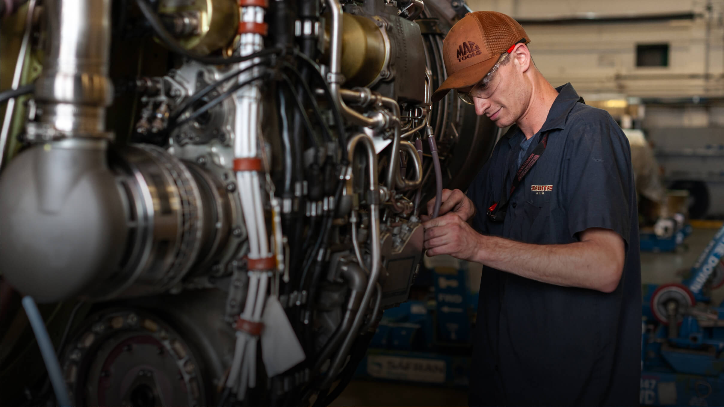 Kalitta Air employee working on an engine