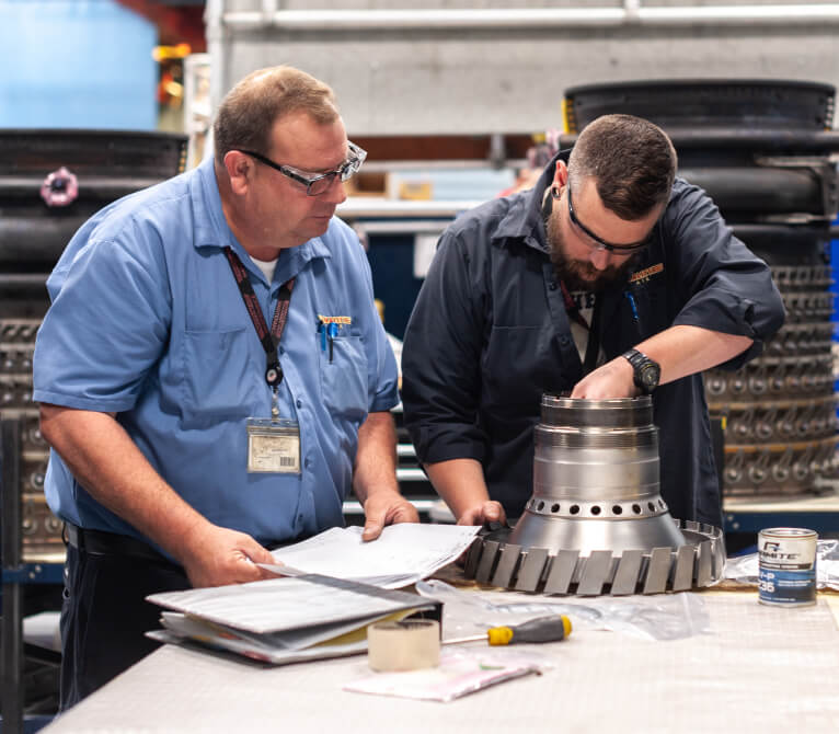 Kalitta Air employees servicing a part
