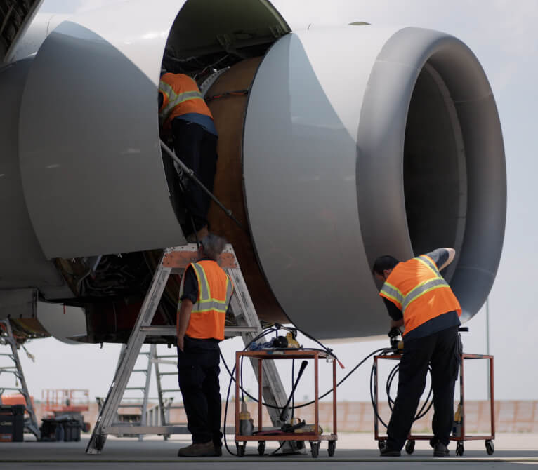 Kalitta Air maintenance technicians working together.
